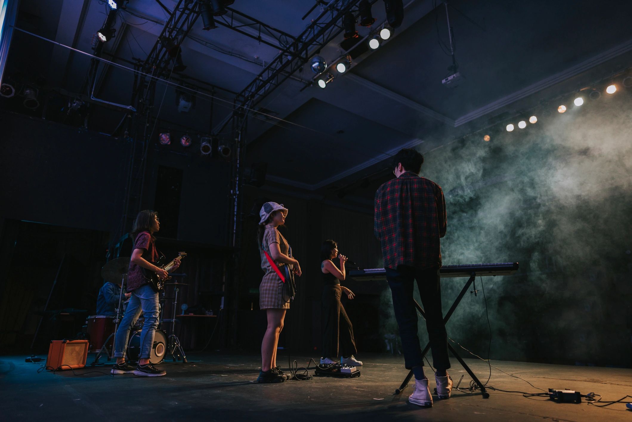 Live concert stage with performers and lights